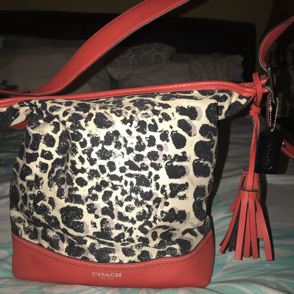 Coach purse in orange and animal print